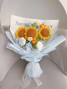 Detailed handmade crochet sunflower bouquet with blue wrap and elegant ribbon bow
