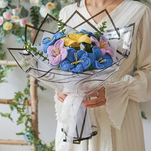 Detailed view of hand-crocheted lilies in black wrap with Love You Forever ribbon