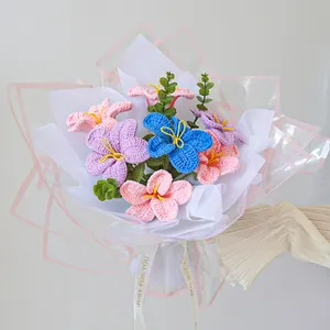 Detail of handmade crochet flower bouquet with colorful lilies and Just For You ribbon