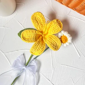 Handmade crochet flower bouquet with yellow petals and white organza ribbon bow