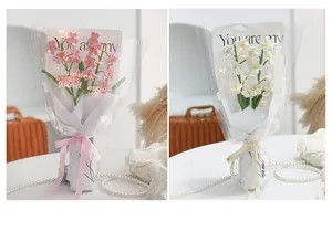 Handmade crochet flower bouquet with delicate paper wrapping and glowing LED string lights