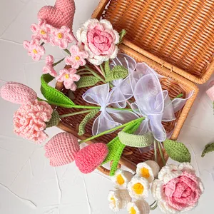 Handmade crochet flower bouquet with roses and tulips in a woven basket for home decor