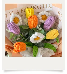 Detail of handmade crochet tulip and daisy bouquet in premium gift wrapping paper