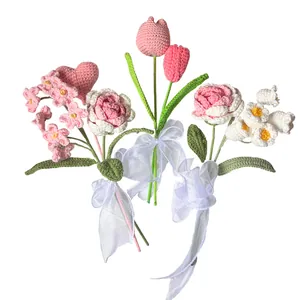 Handmade crochet flower bouquet with tulips and roses featuring white chiffon ribbons
