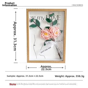 Detailed view of handmade crochet camellia frame with size markings and wooden texture