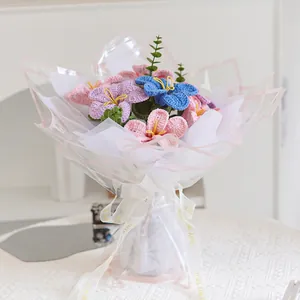 Handmade crochet flower bouquet with mixed colorful blossoms in elegant gift packaging