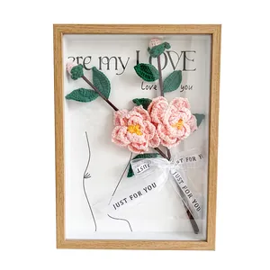 Handmade crochet camellia 3D photo frame with wood texture and elegant pink flowers