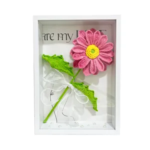 Handmade crochet pink gerbera flower in white shadow box frame with pearl accents