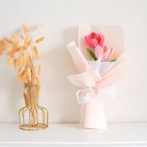 Handmade crochet tulip bouquet in pink wrapping with white ribbon for Mother's Day gift