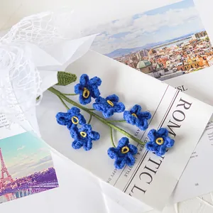 Handmade crochet forget-me-not blue flowers with elegant white mesh gift wrap