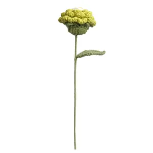 Handmade crochet peony flower with realistic gradient petals and green stem on white background