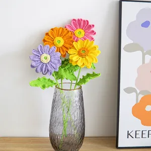 Handmade crochet flower bouquet with colorful gerbera daisies and sunflowers in glass vase