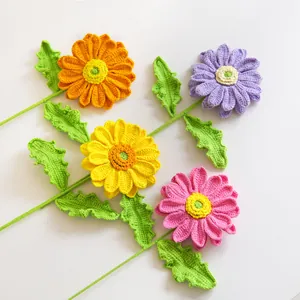 Handmade crochet flower bouquet with orange, purple, yellow, and pink knitted daisies