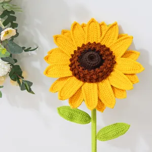 Detailed close-up of handmade crochet sunflower petals and textured brown center yarn core