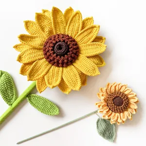 Macro shot of handcrafted crochet sunflowers with detailed yellow petals and knitted texture