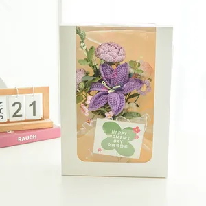 Detail of handcrafted crochet bouquet in white gift box with purple lily and pink floral accents