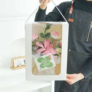 Handmade crochet flower bouquet in a white gift box with transparent window display