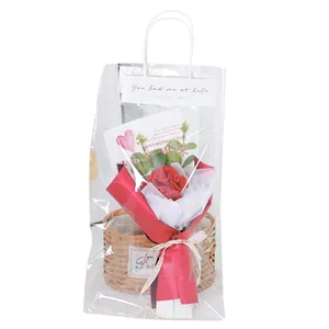 Handmade crochet carnation bouquet in a transparent gift bag with greeting cards