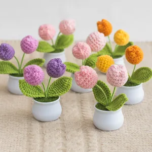 Handmade crocheted tulip potted plants in various vibrant colors for home decor