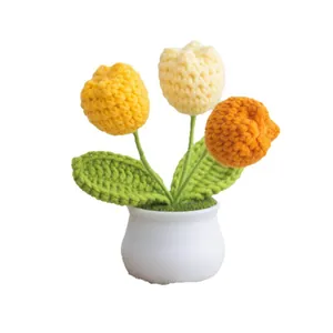 Handmade crochet tulip potted plant with three colorful flowers in a white ceramic pot