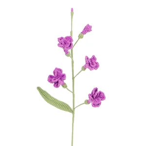 Handmade crochet purple freesia flower bouquet on white background for home decor