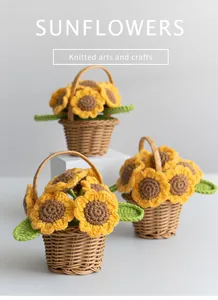 Close-up of three handmade knitted sunflower pots in miniature brown woven baskets