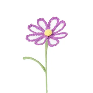 Handmade crochet cosmos flower bouquet with purple petals and green stem on white background