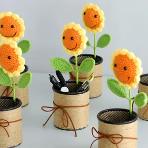 Detailed macro view of handcrafted crochet sunflower with smiling face in pen holder