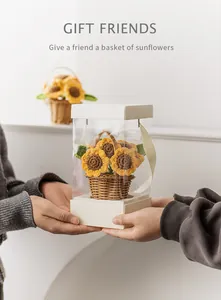 Close-up of handmade crochet sunflower basket in a transparent acrylic gift box