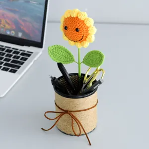 Handmade crochet sunflower pen holder with a smiling face for desk decor and office gifting