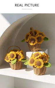 Detail of three handmade crochet sunflower baskets with realistic knit texture and leaves