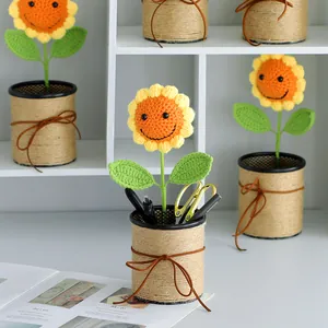 Handcrafted crochet sunflower pen holder with jute rope wrap and smiling face detail