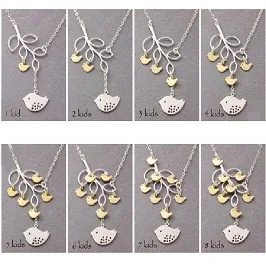 Detail view of bird on branch necklace showing customization from 1 to 8 kids pendants