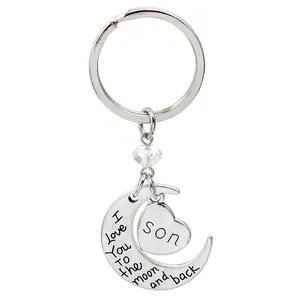 Macro detail of 'I Love You To the moon and back' moon and 'Son' heart pendant keychain