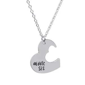 Silver middle sister heart puzzle necklace in polished stainless steel for friendship