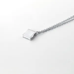 Minimalist silver book necklace pendant with Once Upon a Time fairy tale engraving
