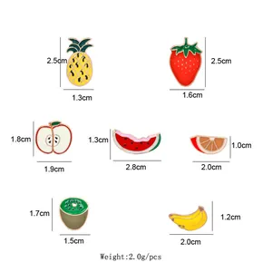 Detailed size chart for colorful fruit enamel pins including pineapple and strawberry