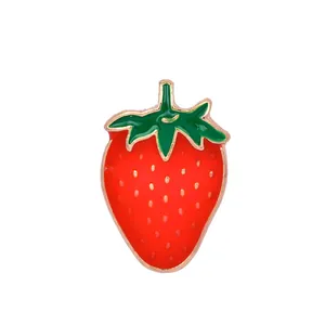 Cute red strawberry enamel brooch pin with gold metal plating and green leaf detail