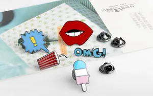 Detailed view of vibrant cartoon enamel pins with lips, ice cream and OMG designs