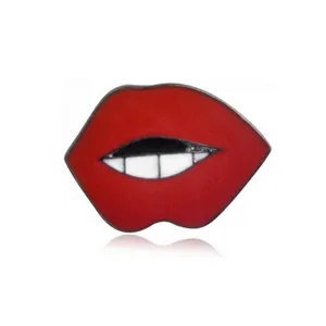 Vibrant red lip enamel pin with white teeth detail and black alloy outline