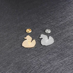 Cute duck silhouette enamel pins set in gold and silver plating with butterfly clutches