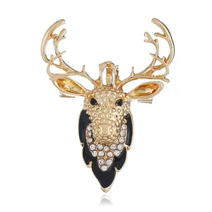 Goldene Weihnachts-Rentier-Brosche mit weißen Strasssteinen und schwarzen Emaille-Details