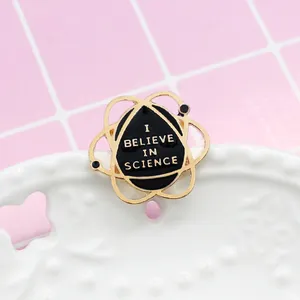 Planet orbit science enamel brooch with I Believe in Science text for denim jackets