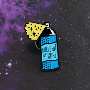 Detail of blue spray can enamel pin with Bullshit Be Gone text on starry background