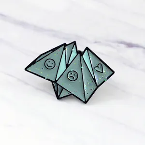 Mint green origami enamel brooch featuring sparkling faces and heart designs