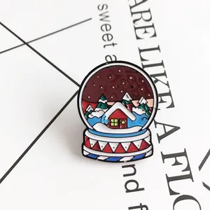 Creative crystal snow globe enamel pin with red house and snowy pine tree landscape