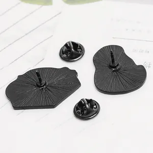 Back view of cute cat avocado enamel pins with black metal butterfly clutches