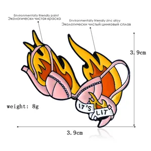 Creative pink bikini enamel pin with burning flames and IT'S LIT text on white ribbon