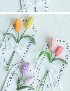 Macro detail of handmade crochet tulip flowers with ribbons and decorative cards