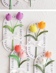 Detailed macro of hand-knitted tulips with textured yarn petals and elegant ribbon bow
